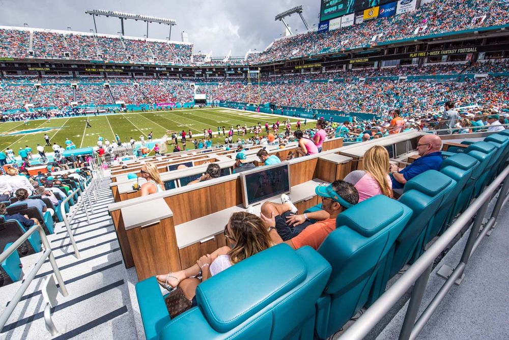 luxury reclining stadium seating in The Living Room suite at Miami Dophins’ Hard Rock StadiumPicture